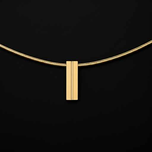 Close-up of a minimalist geometric gold pendant on a fine snake chain. The pendant is a solid rectangular bar with a single vertical line engraved. Photography style is high-contrast black and white with only the gold in color. Premium jewelry aesthetic.